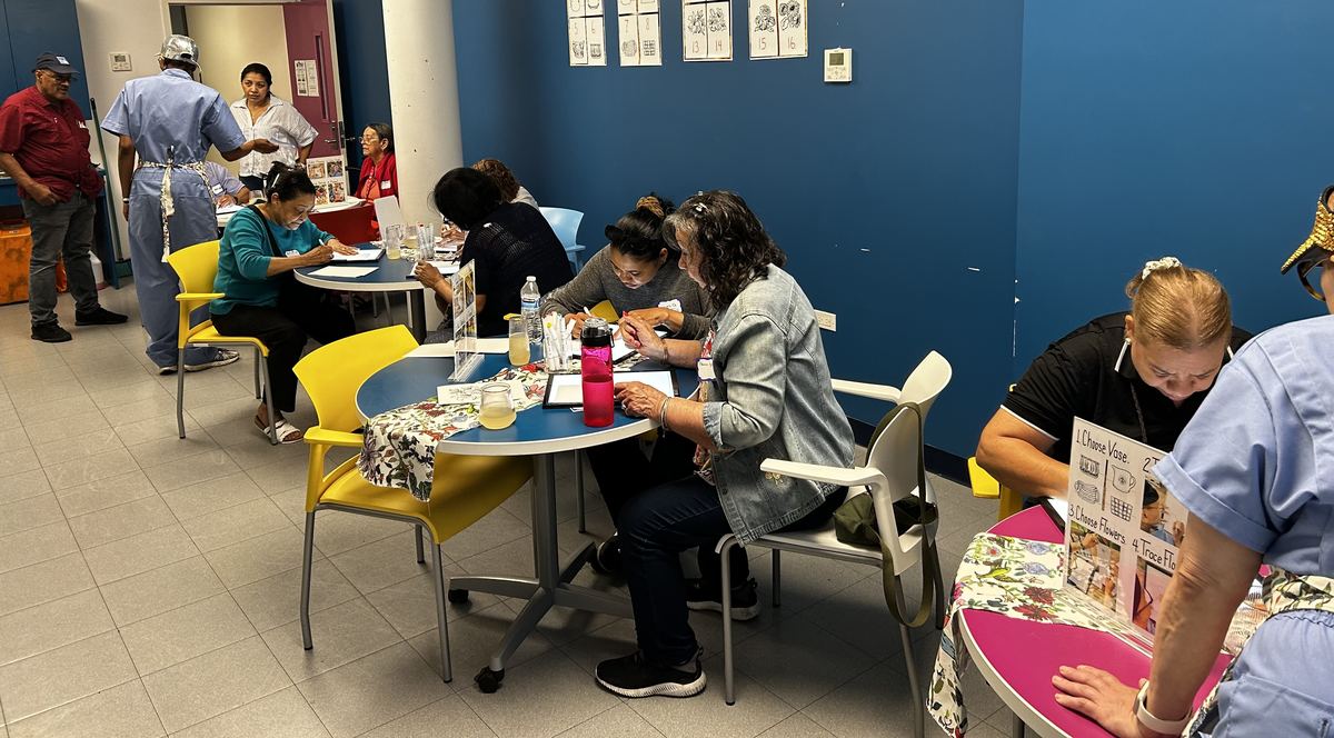 Tables of people working together at the Bouquet Cafe play date